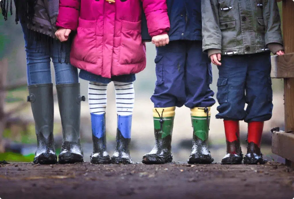 Close-up of the legs of four children