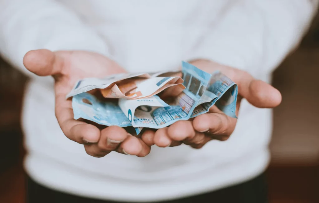 Hands holding cash