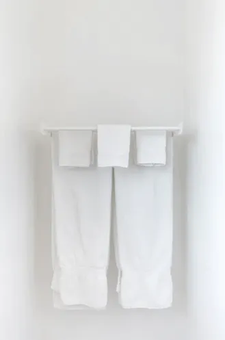 Hanged Towels Behind the Toilet
