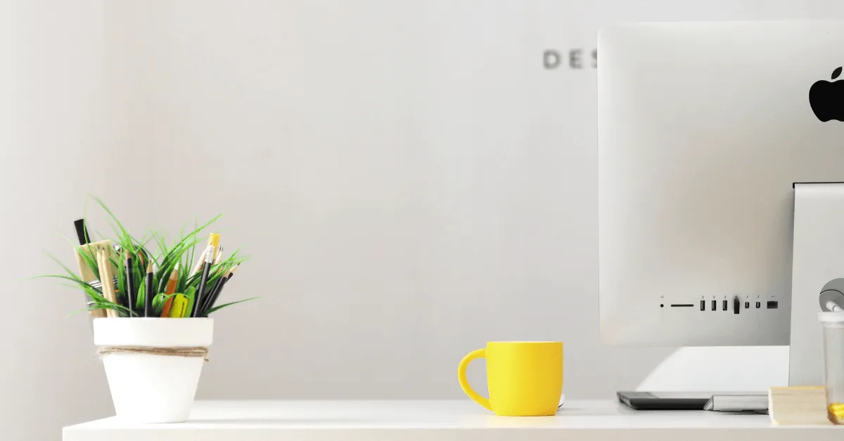A yellow mug on a desk