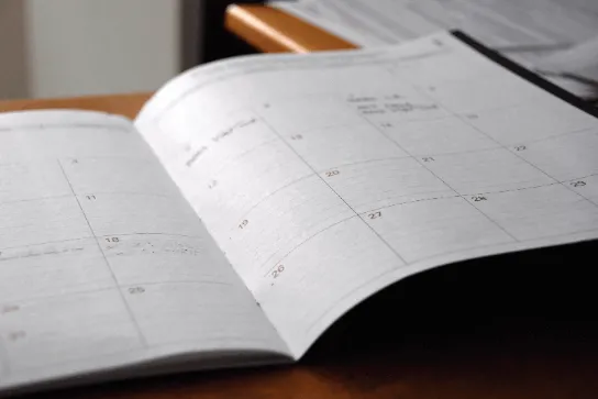 Open calendar on a desk.