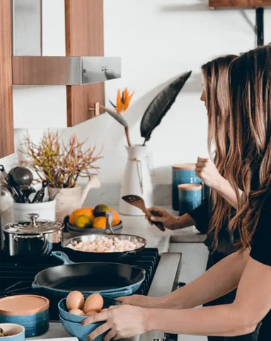 Two Women in the Kitchen Cooking