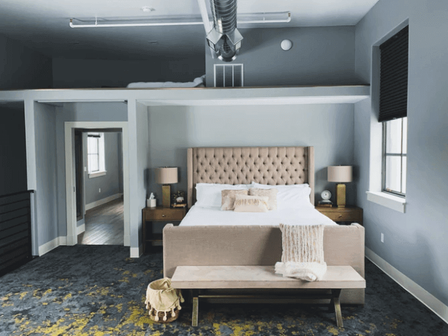 Big-Bed-With-a-Bench-In-Front-of-It