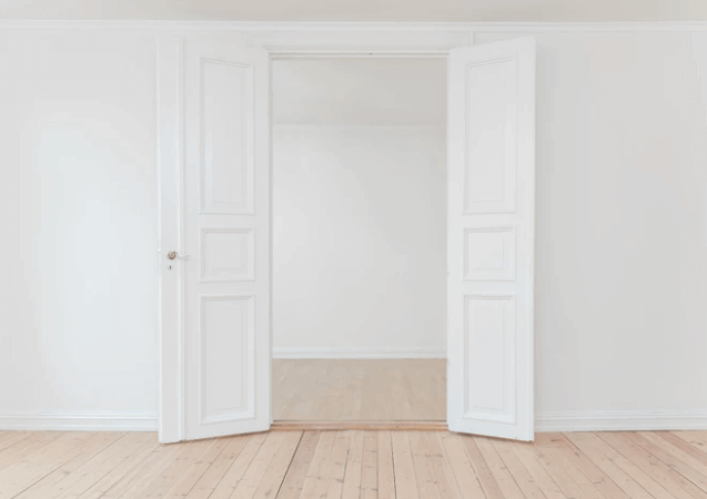 Empty Room With Two White Doors