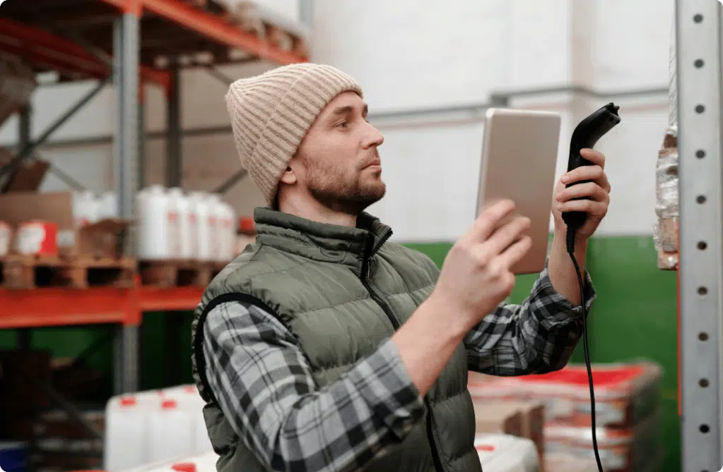 A professional scans an item stored in a warehouse