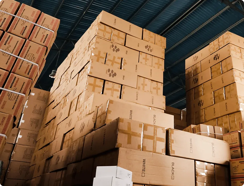 Huge stacks of cardboard boxes stored in a warehouse