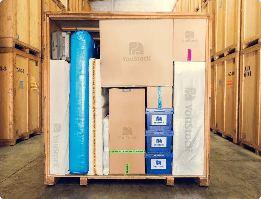 A storage crate open in the middle of a warehouse