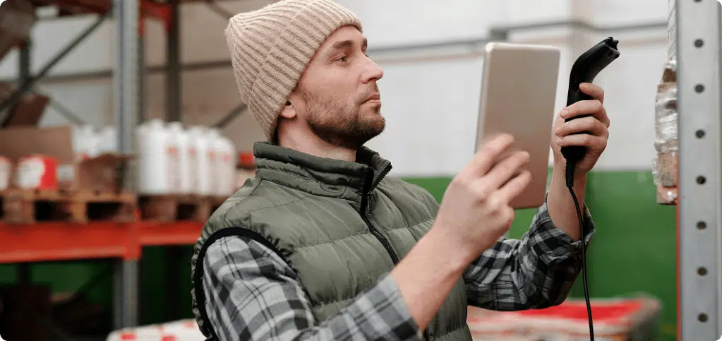 A professional scans an item stored in a warehouse