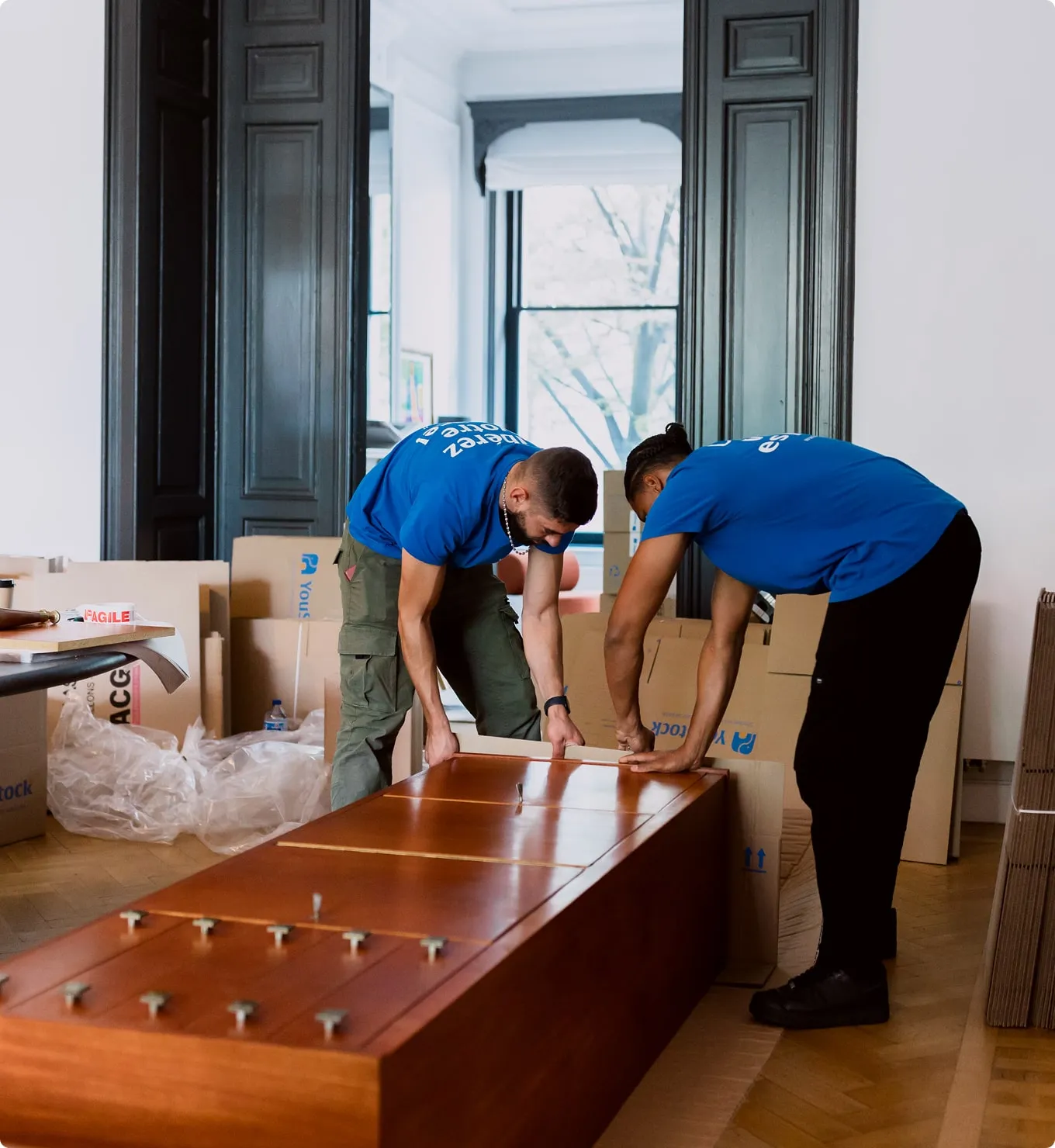 two YouStock movers providing item collection services