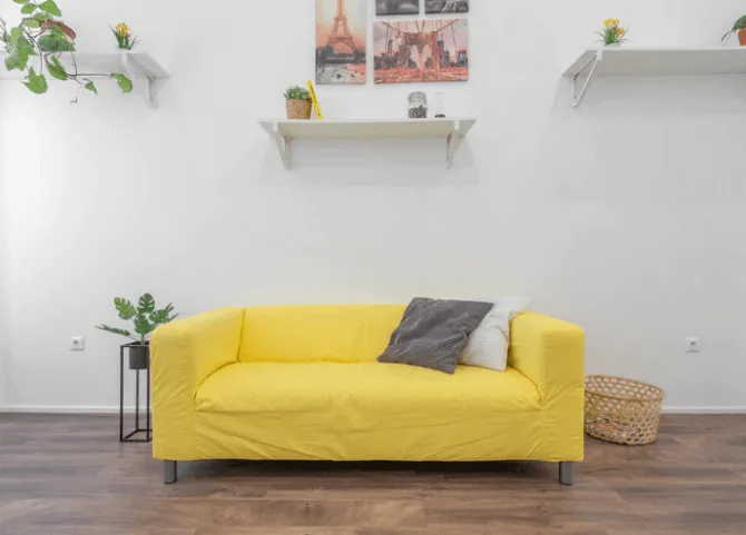 Yellow Sofa With Shelves High Around It