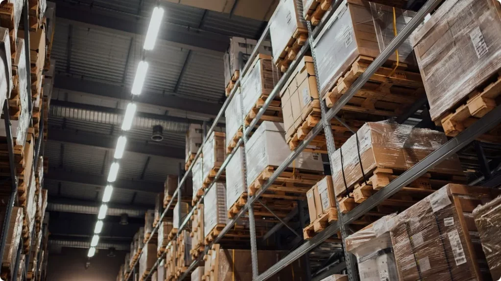 Cardboard boxes stacked on shelves in a storage warehouse
