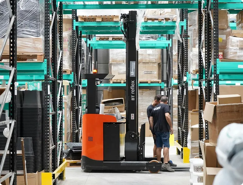Forklift in the middle of a warehouse