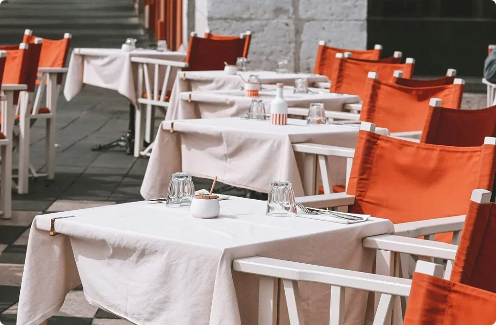 restaurant terrace, tables set for eating