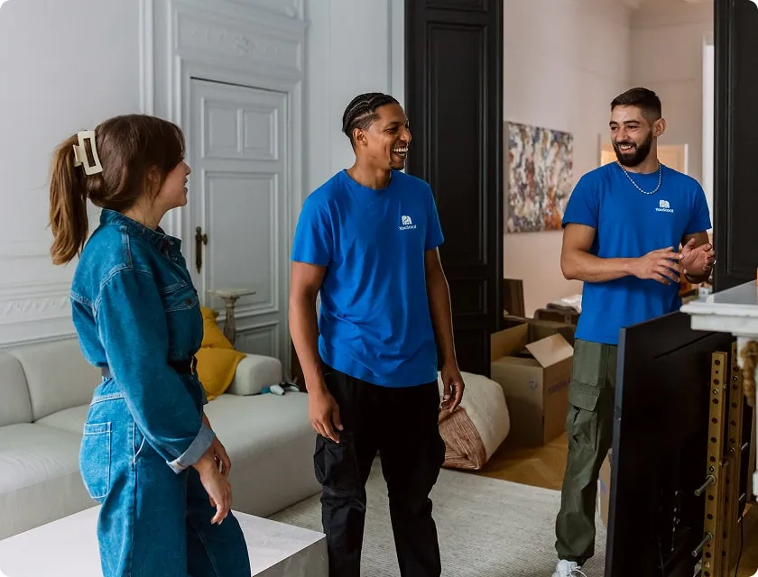 2 YouStock movers chatting with a client