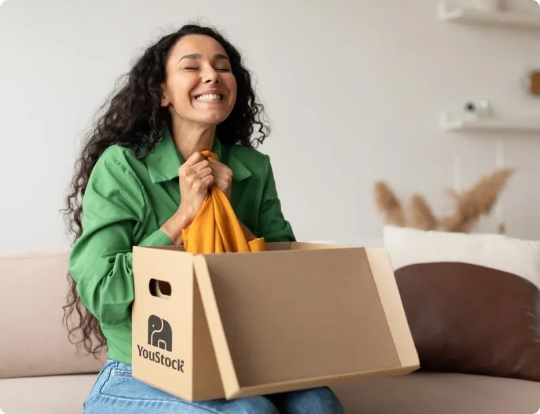 woman opening a Youstock box looking happy